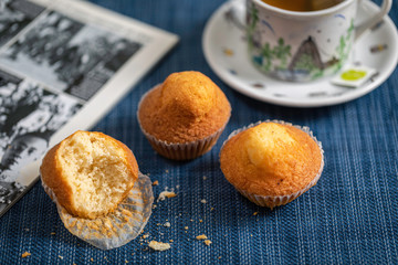 A cup of tea with muffins