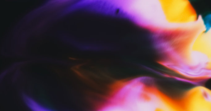 Macro Paint with Neon Color Palette. Oil Mixed with Bright Colourful Dye and Acrylic Paint. Created Shadowy Figure.