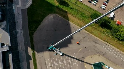 Aerial view of fully extended boom of mobile truck crane. All terrain crane.