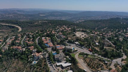 Small town with red rooftops Close to the Mountains Aerial view
Drone, Har adar,August,2020,Israel
