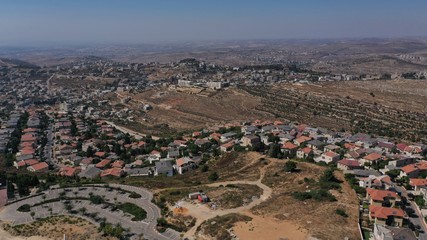 Small town with red rooftops Close to the Mountains Aerial view
Drone, Har adar,August,2020,Israel
