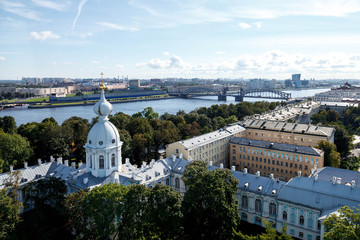 Fototapeta na wymiar View from bell tower Smolny Cathedral with dome with cross. Unique urban landscape center Saint Petersburg. Central historical sights city. Top tourist places in Russia. Capital Russian Empire