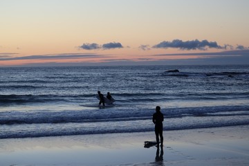 surfing on the beach, north uist, hebrides, scotland