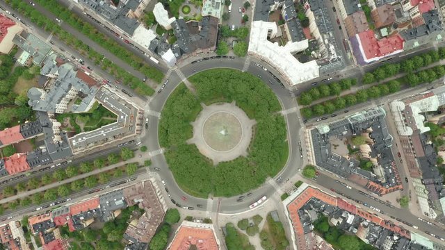 Descending spinning footage of Karlaplan in Stockholm, aerial view 