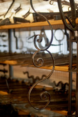 A shop or a museum of blacksmithing.The key hung on the wall. The forged curl.