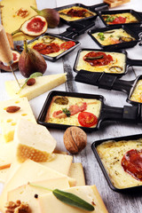 Delicious traditional Swiss melted raclette cheese on diced boiled or baked potato.