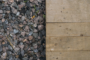 Wood plank and gravel landscape surface material