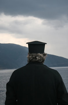 Monk looking at Mount Athos