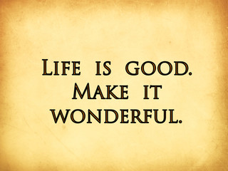 Life is good written on old paper background