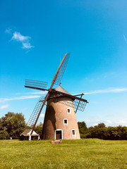 Fototapeta na wymiar Old windmill in the scenic nature