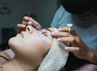 Young woman receiving natural eyelash lift treatment