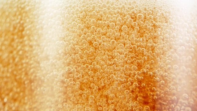 Macro Shot Of Bubbles Rising In A Glass With Beer, Super Slow Motion at 1000 fps.