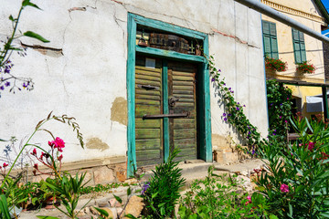 Fototapeta na wymiar vintage old rustic lovely door desing on white wall