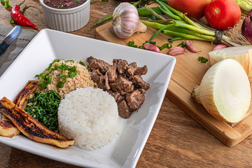 Minced beef tenderloin. Traditional Brazilian food (Picadinho). Selective focus