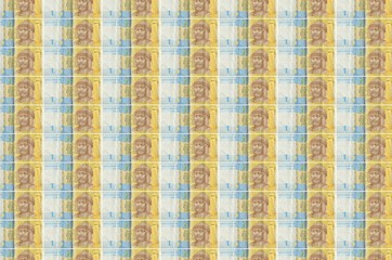 1 Ukrainian hryvnia bills printed in money production conveyor. Collage of many bills. Concept of...