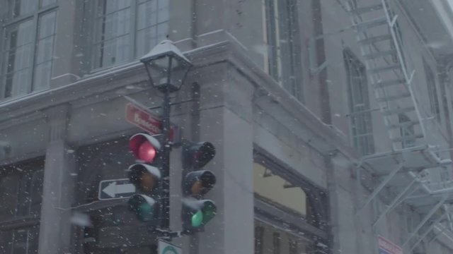 Montreal, Canada - December 8, 2018: Driving car in snow storm, Maisonneuve Boulevard, downtown of Montreal, Quebec, Canada