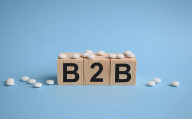 Sales in the b2b market to corporate clients, business to business concept , inscription on wooden...