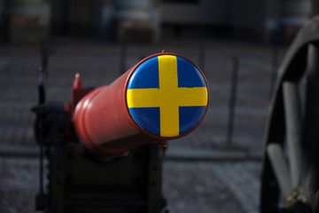 Swedish canon in front of the Royal Palace in Stockholm, cap painted with Swedish national colors.