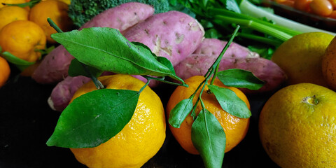 A small variety of fruits and vegetables that have just arrived from the organic fair.