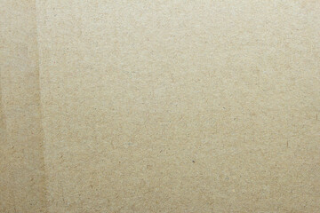 Fototapeta premium Cardboard background with traces of dirt, thread and hair as a textured background.