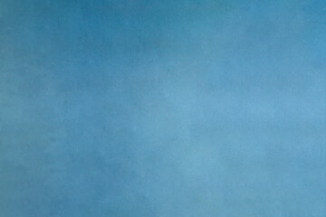 Aged blue textured background with some small paint stains.