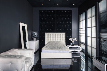Fototapeta na wymiar Modern dark luxury black interior with white chic furniture
