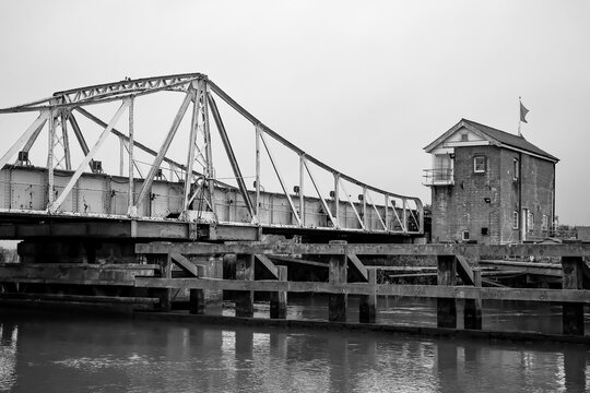 Black and white photo of the Reedham swing bridge over the River Wensum