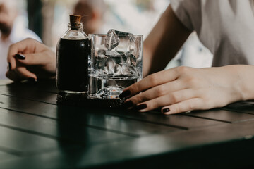 Girl drinking cold brew coffee close up