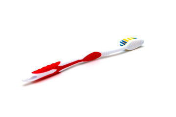 The toothbrush lies on a white background. Brushing your teeth to keep them healthy