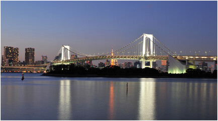 Fototapeta na wymiar Rainbow bridge in the bay of Tokyo after sunset.