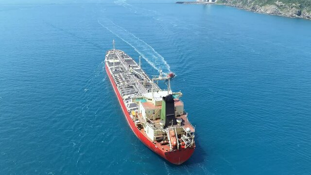 An oil chemical tanker cruising along the Bosporus Sea. Aerial tracking video of a 182 meters long chemical tanker ship
