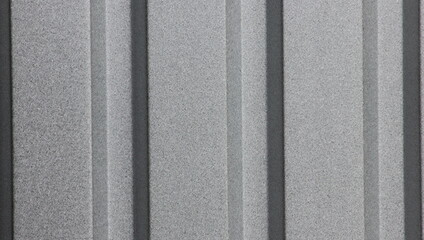 Fototapeta premium The textured background surface of the corrugated metallic grey color