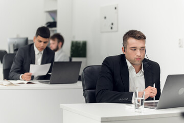 A real estate agent at the Agency's workplace negotiates with the client via the Internet and phone