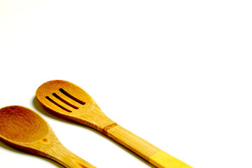 wooden spoons on a white background. culinary concept.