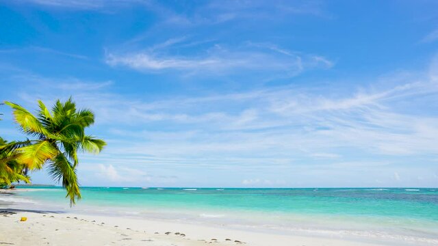 Tropical seascape. Intact clear white sand beach background. Crystal clear sea wave on clear sandy beach with sea view.