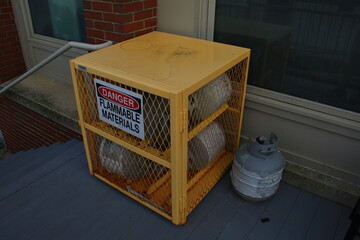 yellow propane storage box outside