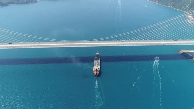 An oil chemical tanker with full of load sailing under the YSS Bridge. Exhaust emissions from diesel engines comprise nitrogen oxygen carbon dioxide monoxide oxides sulphur hydrocarbon vapour & smoke
