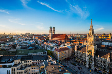 Aerial view of Munich - Marienplatz, Neues Rathaus and Frauenkirche from St. Peter's church on sunset. Munich, Germany