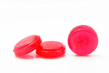 Medical  red lozenges for relief cough, sore throat and throat irritation isolated on white background.