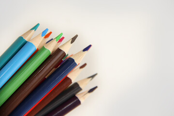 colored pencils on white background