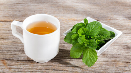 Purple sage plant and tea on the table