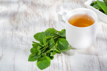 Purple sage plant and tea on the table