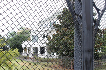 house behind fence