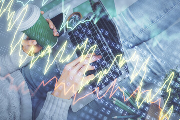 Double exposure of woman hands typing on computer and forex chart hologram drawing. Stock market invest concept.