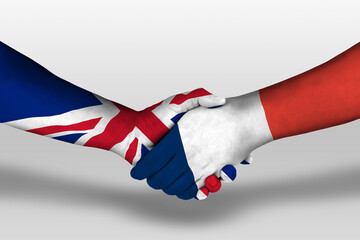 Handshake between france and united kingdom flags painted on hands, illustration with clipping path.