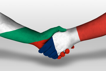 Handshake between france and bulgaria flags painted on hands, illustration with clipping path.