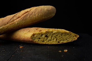 Two curry baguettes on black table 