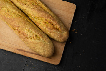 Two curry baguettes top view on wooden table