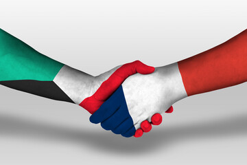 Handshake between france and kuwait flags painted on hands, illustration with clipping path.