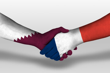 Handshake between france and qatar flags painted on hands, illustration with clipping path.